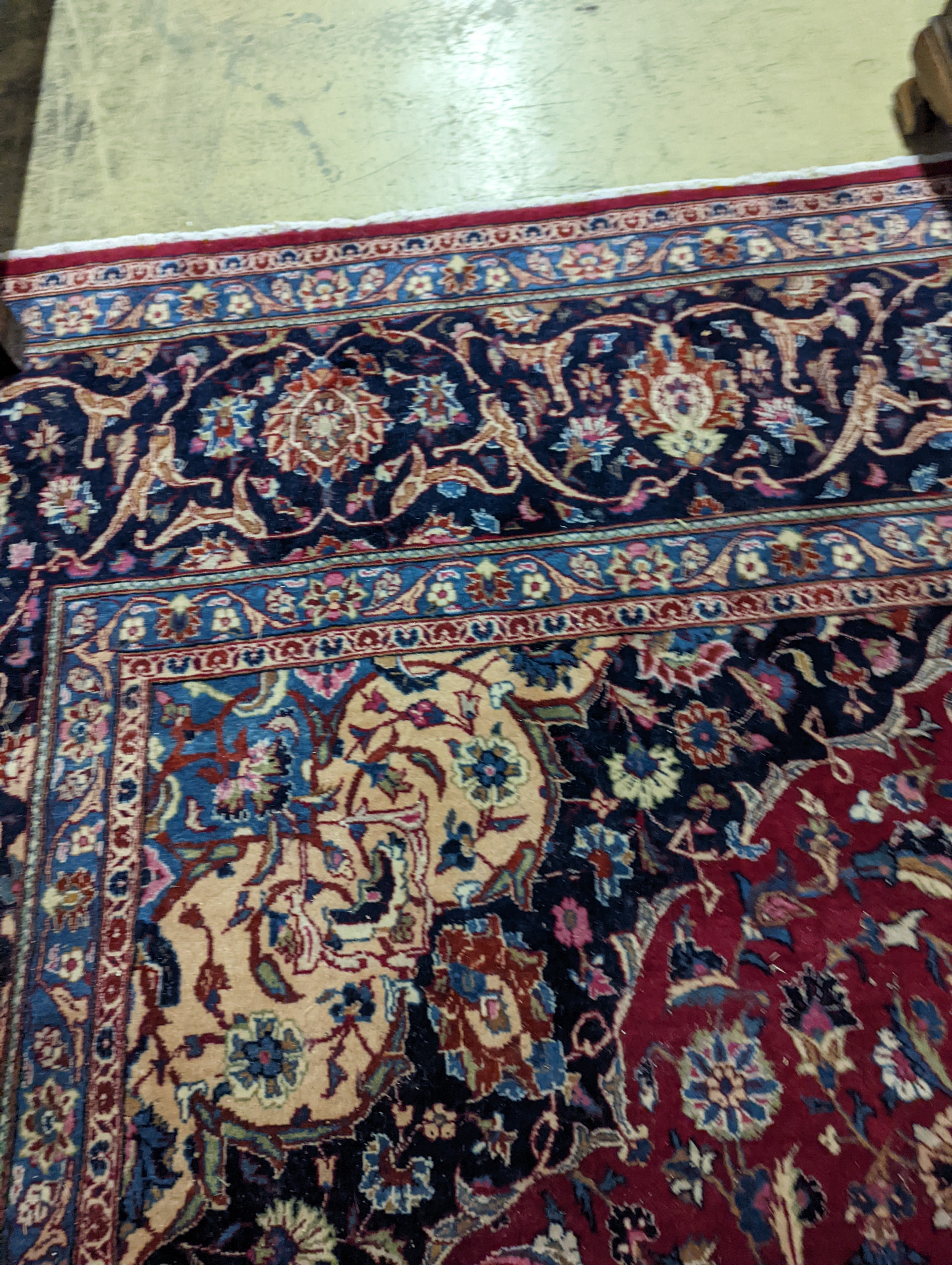 A Kashan burgundy ground carpet, 380 x 300cm